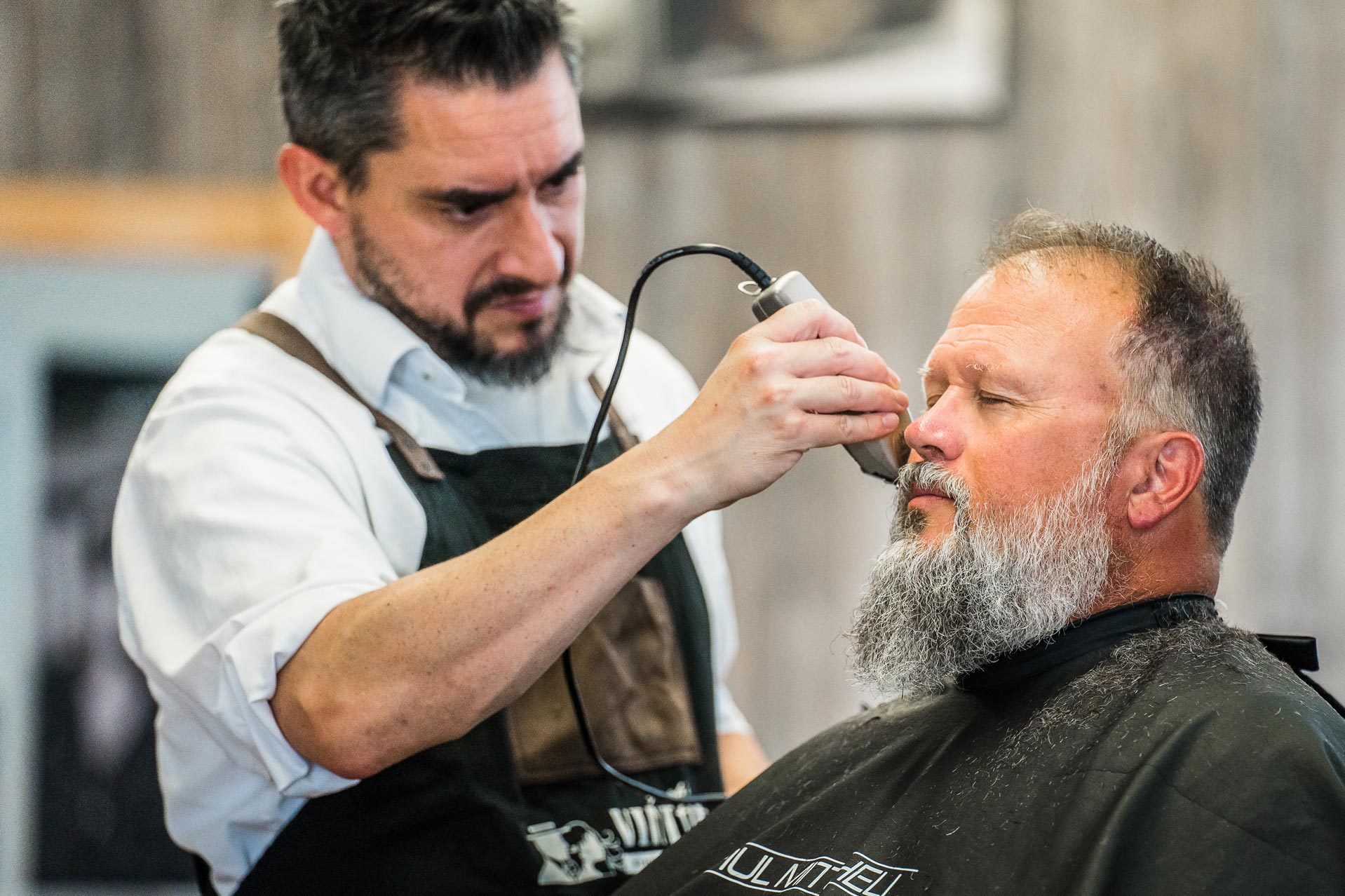 Joe's Vintage Barbershop giving a haircut